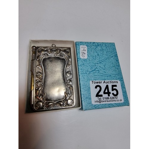 245 - A vintage Art Nouveau silver plated hand held note pad holder with pencil with an ornate design to t... 