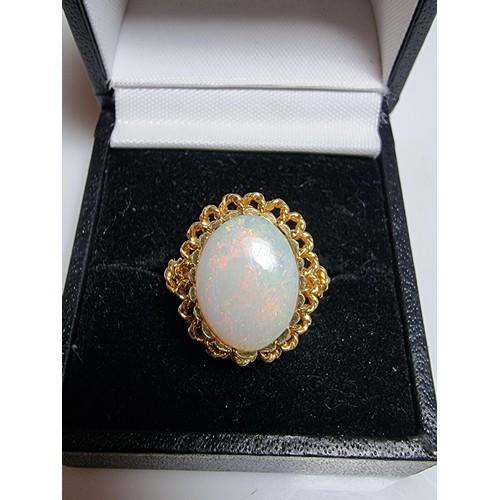 248 - A beautiful 18ct yellow gold ornate ring inset with a large oval genuine white opal stone having fie... 