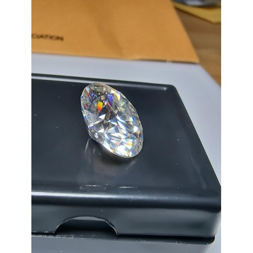 253 - A 10ct moissanite diamond with a diameter of 14mm with full report, the moissanite has a colour grad... 