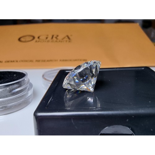 253 - A 10ct moissanite diamond with a diameter of 14mm with full report, the moissanite has a colour grad... 