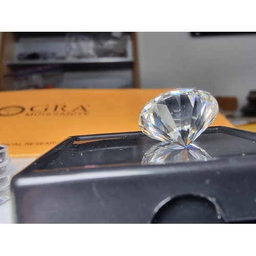 253 - A 10ct moissanite diamond with a diameter of 14mm with full report, the moissanite has a colour grad... 