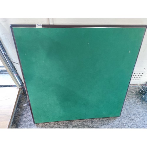 504 - A folding card table with baize top, solid construction 90cm x 90cm