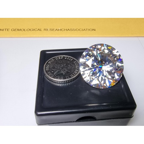 254 - A stunning very rare and large 30ct moissanite diamond with a diameter of 20mm with full report, the... 