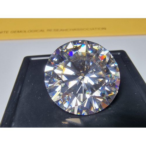 254 - A stunning very rare and large 30ct moissanite diamond with a diameter of 20mm with full report, the... 