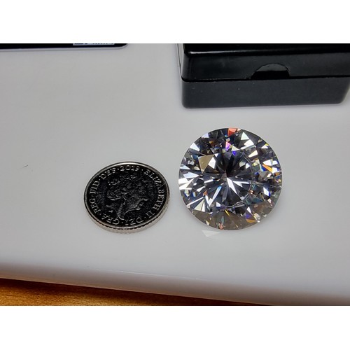 254 - A stunning very rare and large 30ct moissanite diamond with a diameter of 20mm with full report, the... 