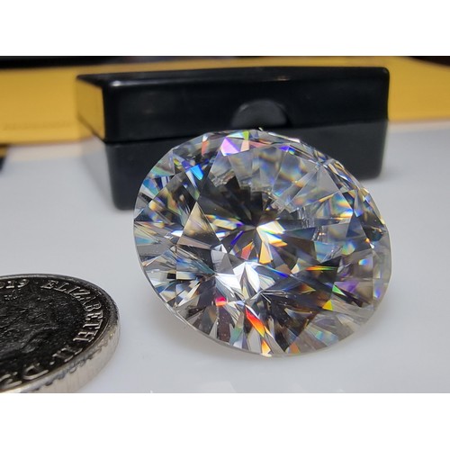 254 - A stunning very rare and large 30ct moissanite diamond with a diameter of 20mm with full report, the... 