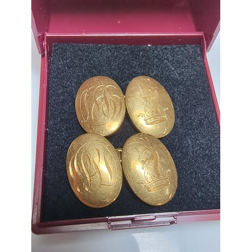 258 - A pair of fine quality hallmarked 18ct yellow gold pair of cufflinks with a family crest design of a... 