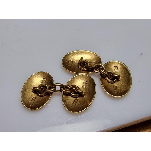 258 - A pair of fine quality hallmarked 18ct yellow gold pair of cufflinks with a family crest design of a... 