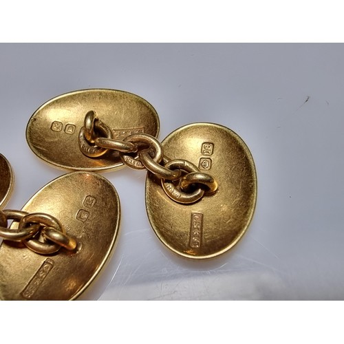 258 - A pair of fine quality hallmarked 18ct yellow gold pair of cufflinks with a family crest design of a... 