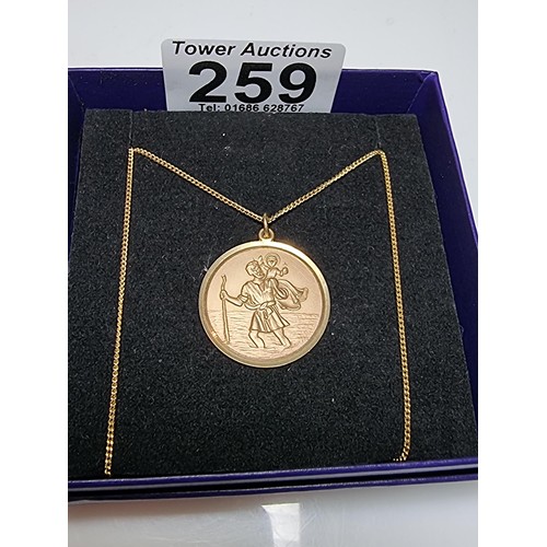 259 - A hallmarked 9ct yellow gold st Christopher pendant on a 18