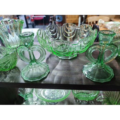 532 - 5 shelves full of glassware to include 2 uranium glass candlestick and glass vases, bowls etc and a ... 