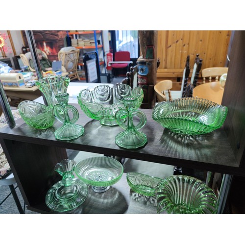 532 - 5 shelves full of glassware to include 2 uranium glass candlestick and glass vases, bowls etc and a ... 