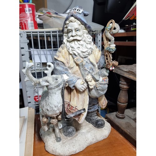 286 - Good quality chalk Santa in blue and white with reindeer, one antler is A/F height 43cm width 21cm