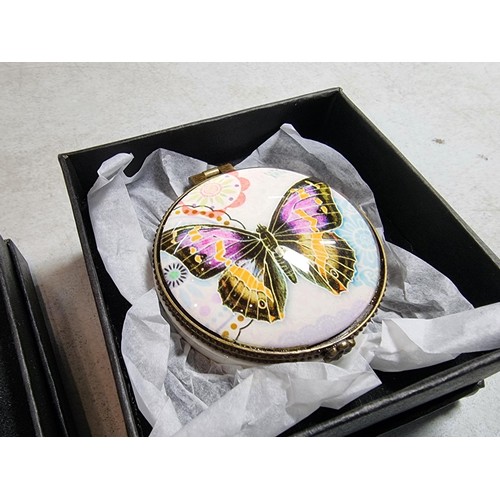 295 - Quantity of 3x boxed collectable boxes inc a ceramic pot with glass butterfly lid, a rose lidded 2 c... 