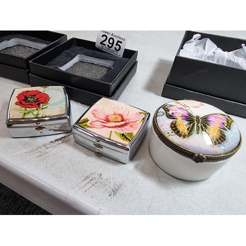 295 - Quantity of 3x boxed collectable boxes inc a ceramic pot with glass butterfly lid, a rose lidded 2 c... 