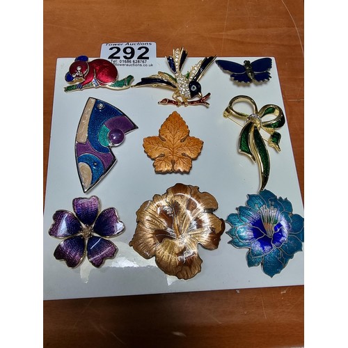 292 - Collection of 9x good quality enamel brooches featuring 3x flower brooches with ornate designs a map... 