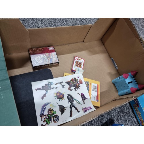 77A - A  box full of board games and toys to include a tin full of Pokémon cards (2022 editions) and unuse... 