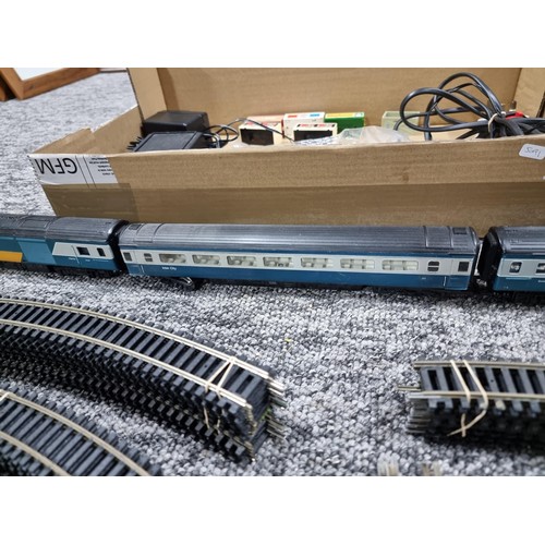 72 - A box of good OO gauge Hornby train items to include an intercity 125, power loco, dummy loco and co... 