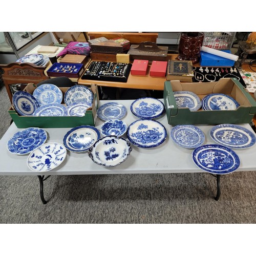 93 - 2x boxes containing a large quantity of blue and white design plates, bowls, chop plates inc Old Wil... 