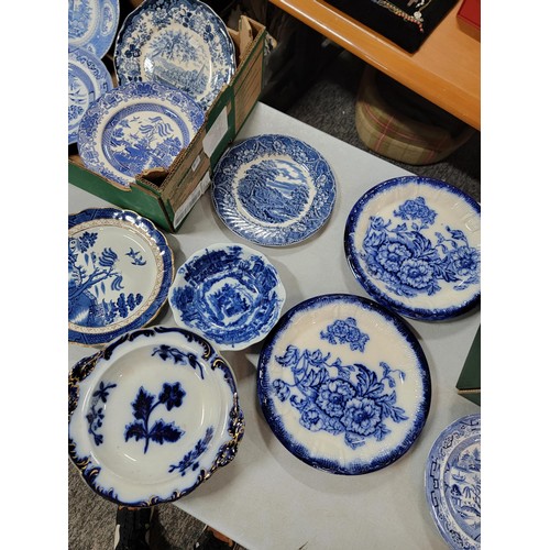 93 - 2x boxes containing a large quantity of blue and white design plates, bowls, chop plates inc Old Wil... 