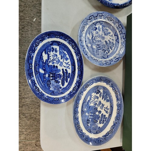 93 - 2x boxes containing a large quantity of blue and white design plates, bowls, chop plates inc Old Wil... 