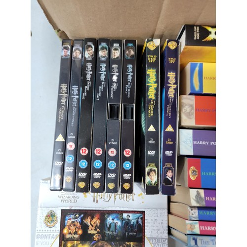 96 - A box of Harry Potter items including 2023 calendar,  8x dvd's inc Harry Potter and the Prisoner of ... 