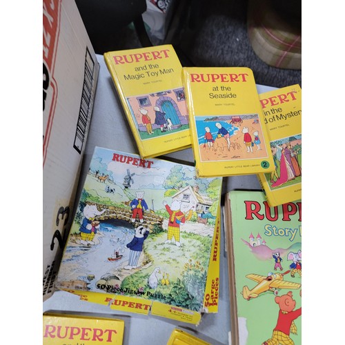 98 - 2x boxes containing a large quantity of Rupert bear books inc annuals, books, a Rupert bear bubble b... 