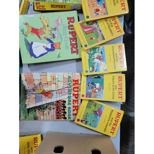 98 - 2x boxes containing a large quantity of Rupert bear books inc annuals, books, a Rupert bear bubble b... 