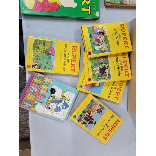 98 - 2x boxes containing a large quantity of Rupert bear books inc annuals, books, a Rupert bear bubble b... 