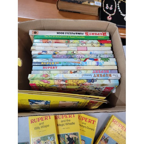 98 - 2x boxes containing a large quantity of Rupert bear books inc annuals, books, a Rupert bear bubble b... 