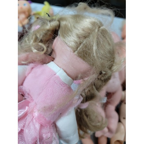 102 - Large quantity of dolls inc a cititoy doll, a doll with a light up heart beat etc