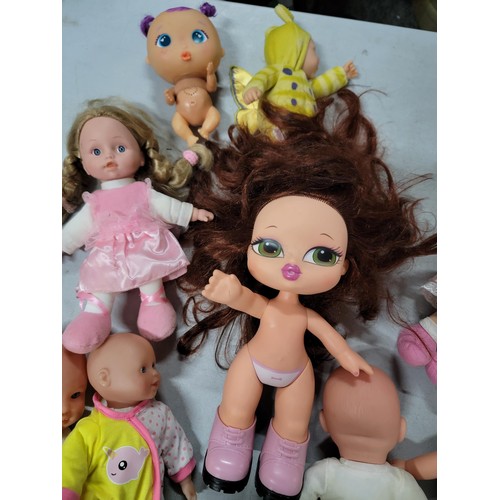 102 - Large quantity of dolls inc a cititoy doll, a doll with a light up heart beat etc