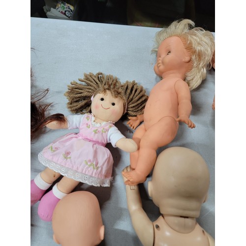 102 - Large quantity of dolls inc a cititoy doll, a doll with a light up heart beat etc