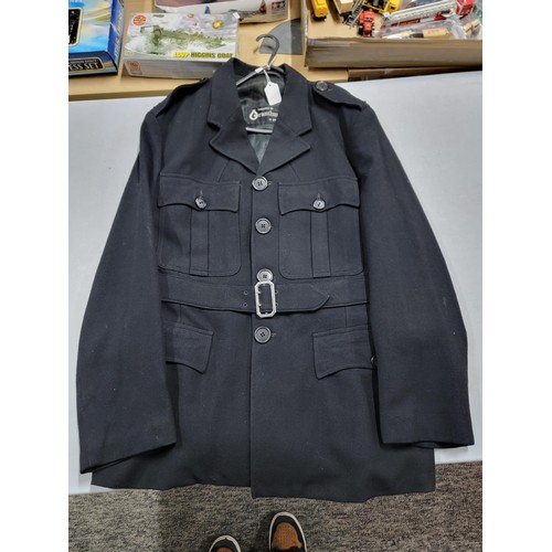 106 - Vintage 1950's Surrey police officers jacket, complete with belt, numbers have been removed from the... 