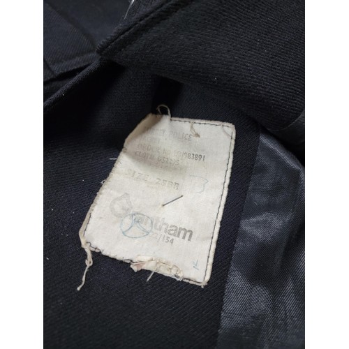 106 - Vintage 1950's Surrey police officers jacket, complete with belt, numbers have been removed from the... 