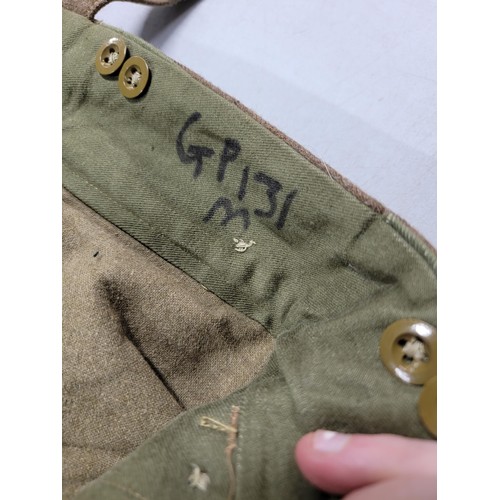 110 - Pair of vintage British 1955 battle dress trousers with the crows foot mark to the label in very goo... 