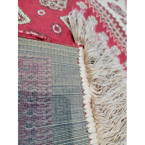 113 - Good quality vintage hand woven red and cream carpet, has always been hung on the wall. length 187cm... 