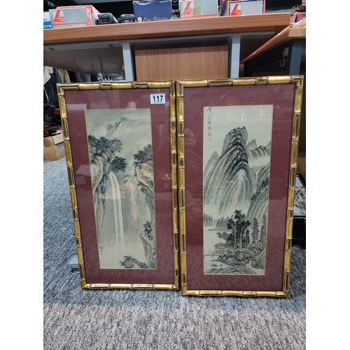 117 - Pair of famed and glazed bamboo gilt framed oriental signed pictures depicting a waterfall and lake ... 