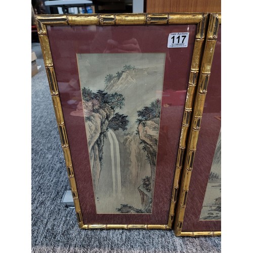 117 - Pair of famed and glazed bamboo gilt framed oriental signed pictures depicting a waterfall and lake ... 