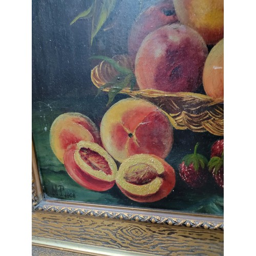 120 - Framed oil on board of a still life scene of peaches in a bowl, in an ornate gilt frame, signed to l... 