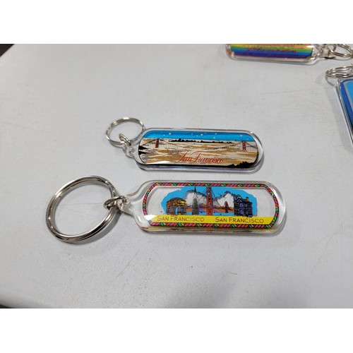 126 - Large quantity of collectable key rings inc surf boards, Florida, Scotland, Blackpool tower etc