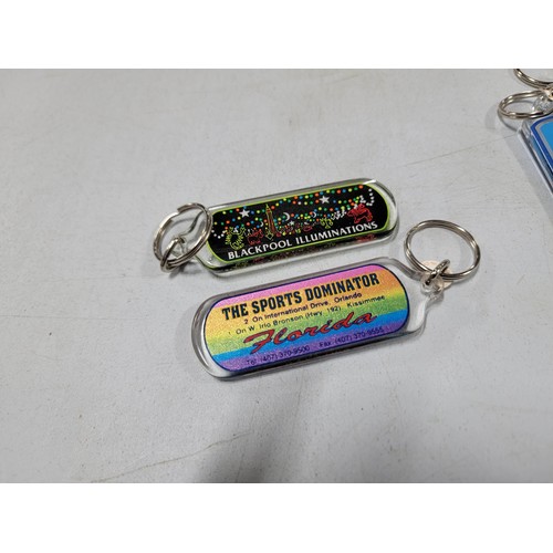 126 - Large quantity of collectable key rings inc surf boards, Florida, Scotland, Blackpool tower etc