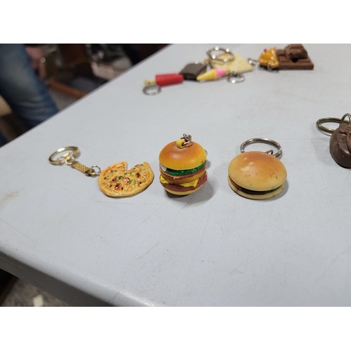 127 - Large collection of fast food related key rings inc burgers, fries, hot dogs, chocolate, ice cream e... 