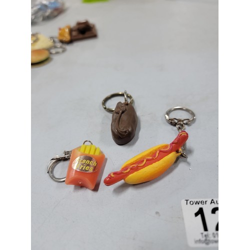 127 - Large collection of fast food related key rings inc burgers, fries, hot dogs, chocolate, ice cream e... 