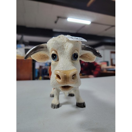 133 - Good quality heavy resin butchers bull figure of a Herefordshire bull, old repair to one leg, 18cm h... 