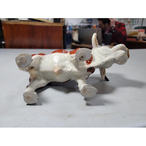 133 - Good quality heavy resin butchers bull figure of a Herefordshire bull, old repair to one leg, 18cm h... 