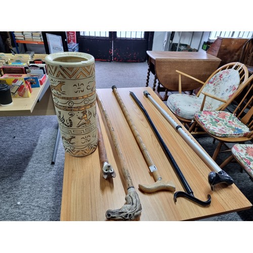 1 - A collection of 5x walking sticks along with a stoneware stick pot with an Egyptian scene. 2 of the ... 