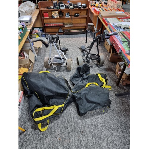 4 - 2x electric golf trolleys by powakaddy for spares or repairs. 1 includes its lithium battery, and ch... 