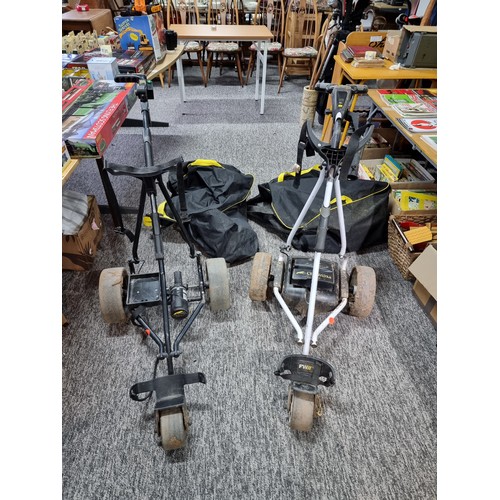 4 - 2x electric golf trolleys by powakaddy for spares or repairs. 1 includes its lithium battery, and ch... 