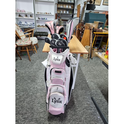 6 - A ladies right handed gold club set, all colour coded pink, to include a Lynx gold bag complete with... 